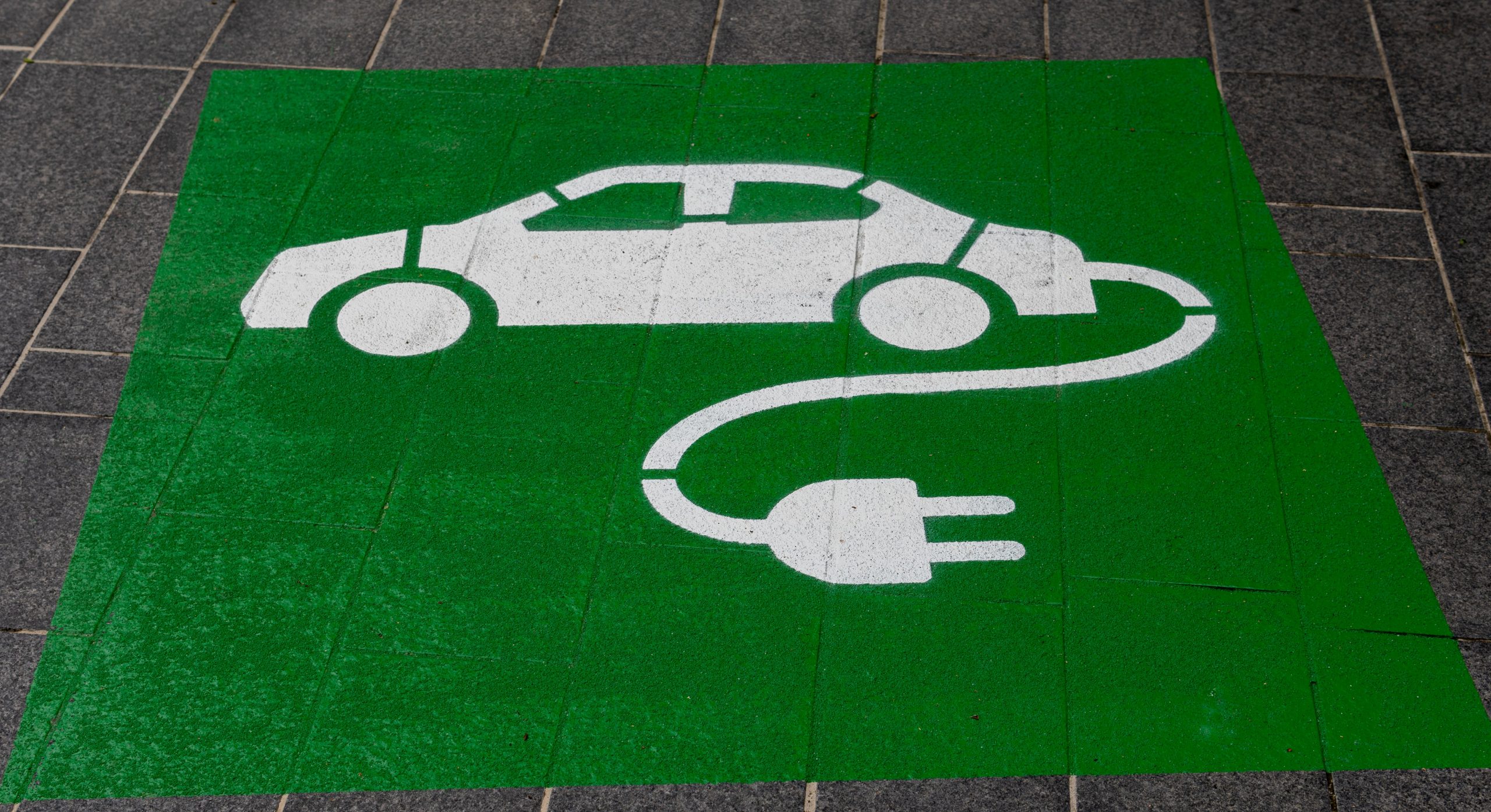elecric car symbol on parking space pavement